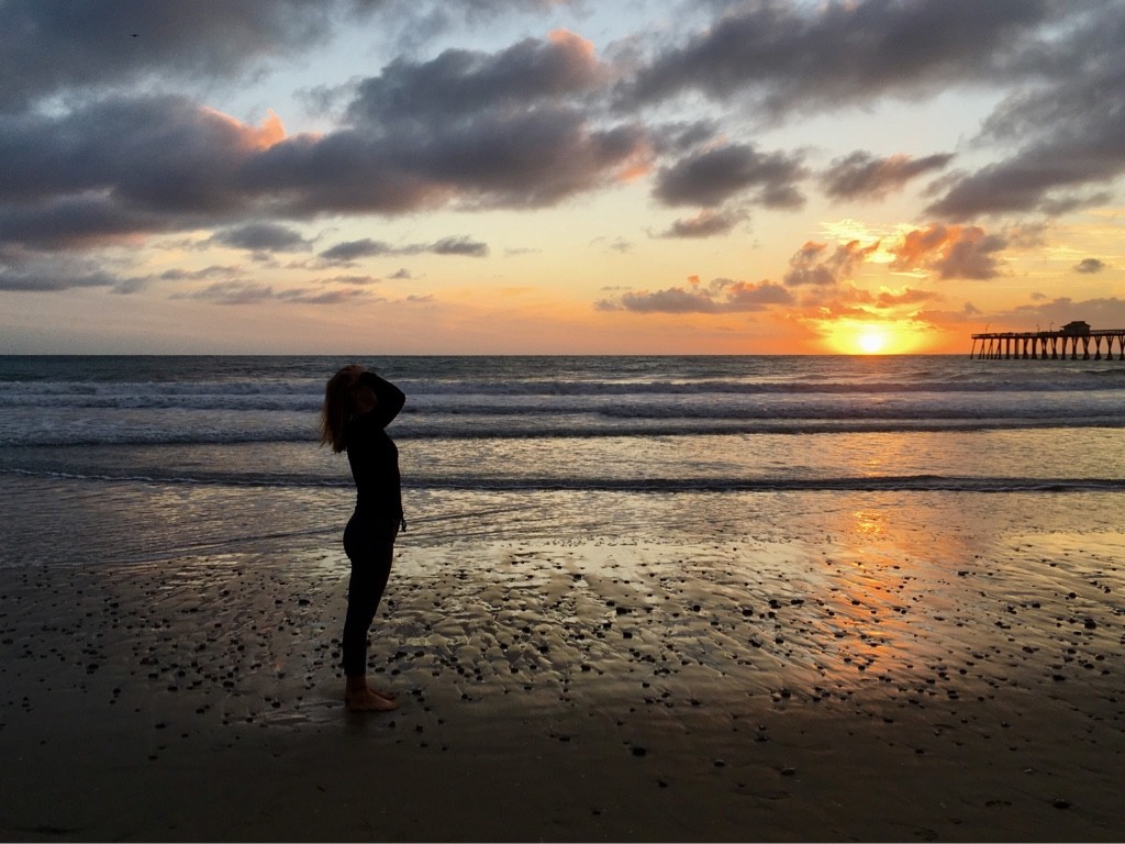 Anika at the beach at sunset
